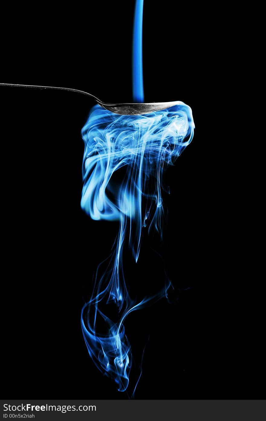 Smoke is flowing into a spoon. Smoke is flowing into a spoon