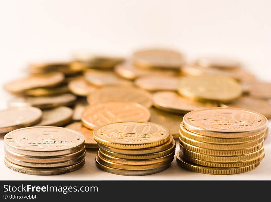 Coins stacks arranged isolated on white. Coins stacks arranged isolated on white