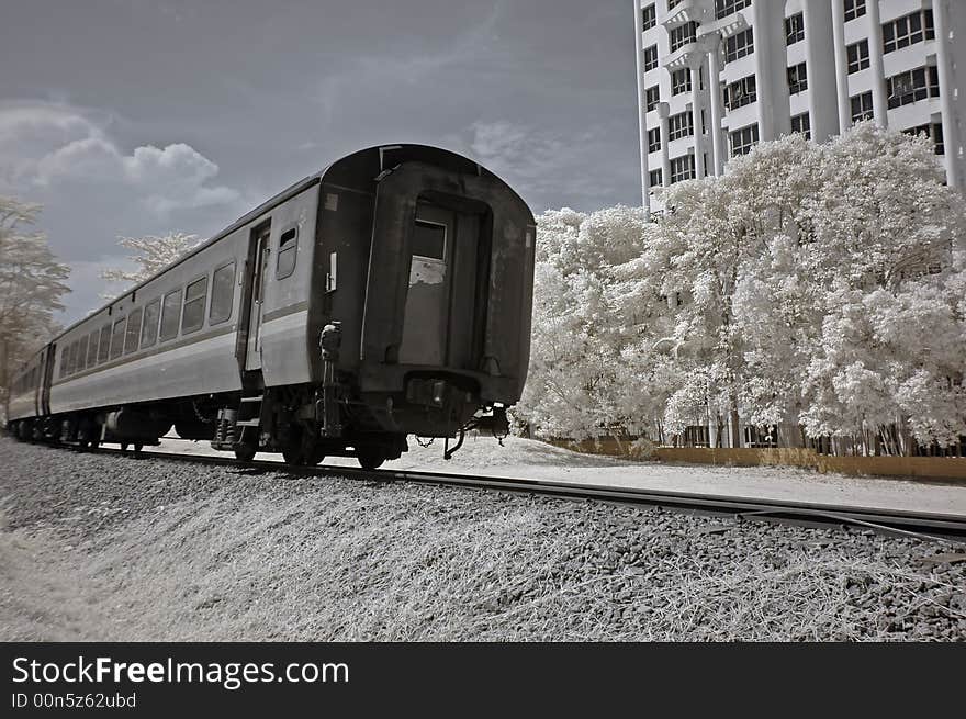 Infrared photo- tree, building and train