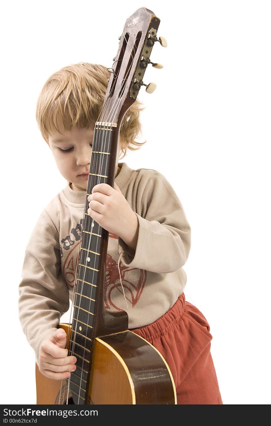 Young girl is playing a guitar. Young girl is playing a guitar