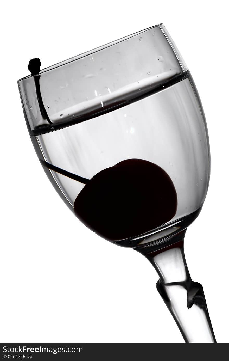 Cherry in glass black-and-white photo  (isolated with clipping path). Cherry in glass black-and-white photo  (isolated with clipping path)