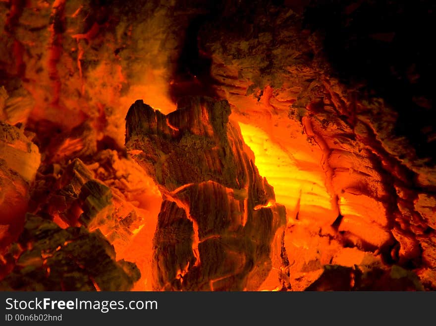 Photo of burning hood in a fireplace