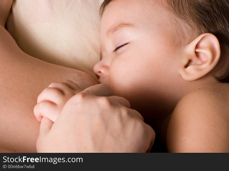 Little kid sleeping and breast-feed. Little kid sleeping and breast-feed