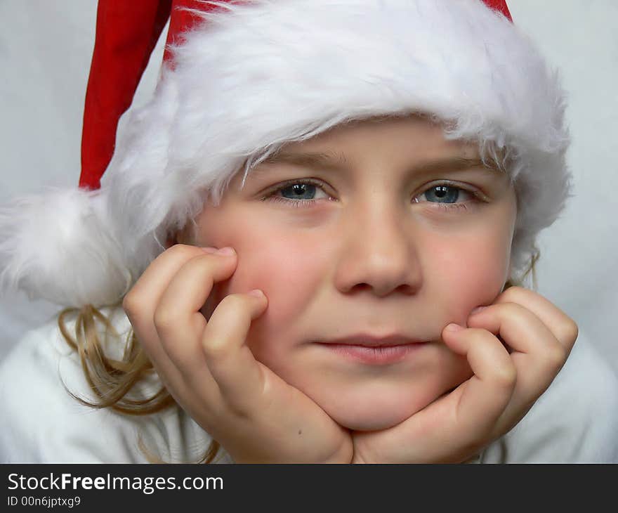 Small boy  in red Santa dress is looking at you. Small boy  in red Santa dress is looking at you.