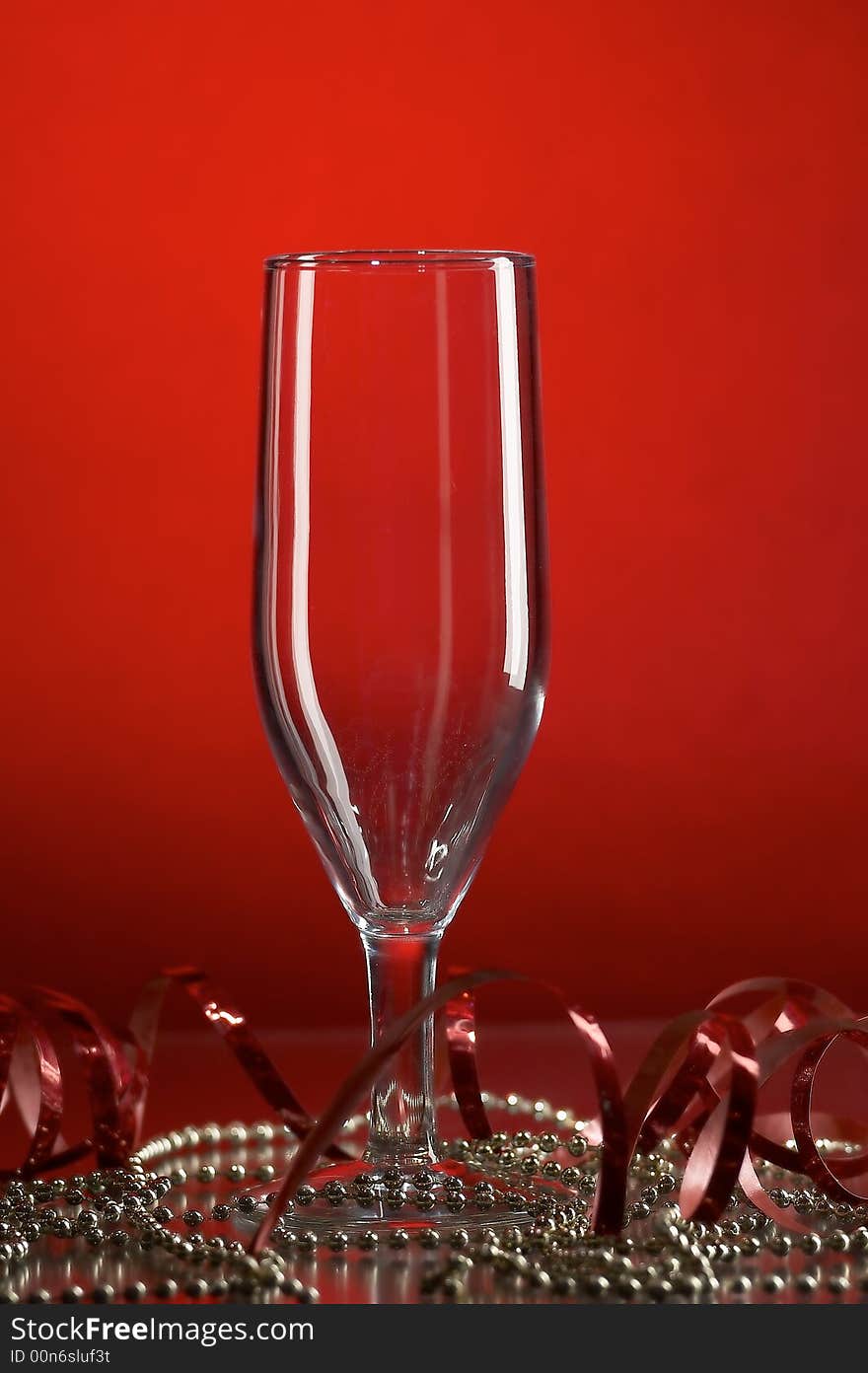 Still life with glass on the red background