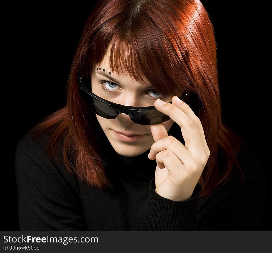 Girl with sunglasses staring at camera