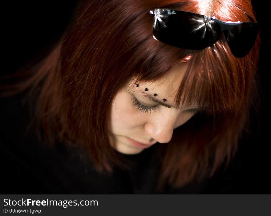 Sad redhead girl looking down and feeling lost.

Shot in studio. Sad redhead girl looking down and feeling lost.

Shot in studio.