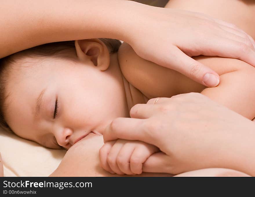 Little kid sleeping and breast-feed. Little kid sleeping and breast-feed