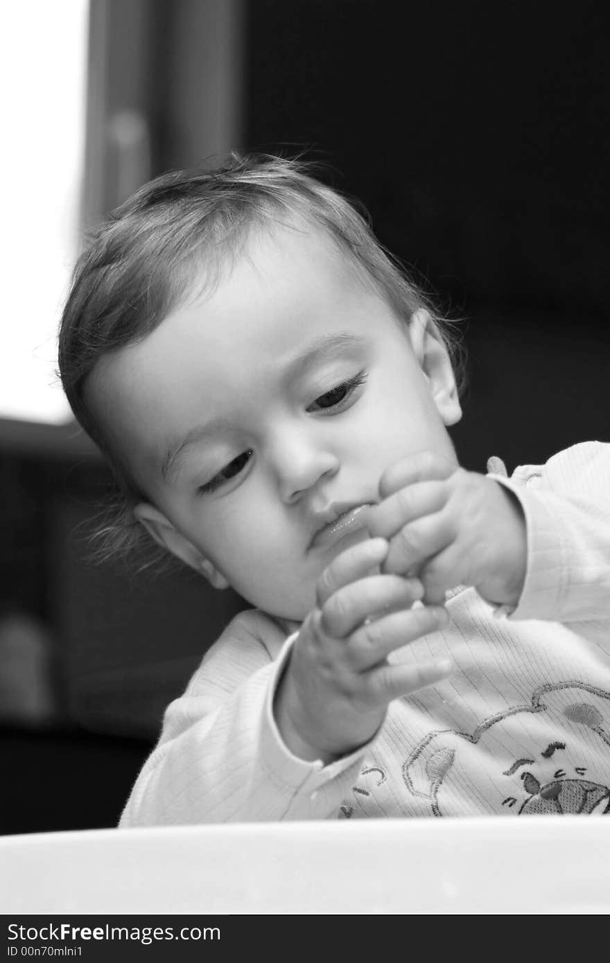 Small children playing with his hands. Small children playing with his hands