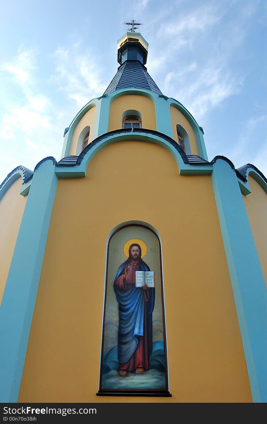 Front of modern little Christian church chapel with fresco. Front of modern little Christian church chapel with fresco