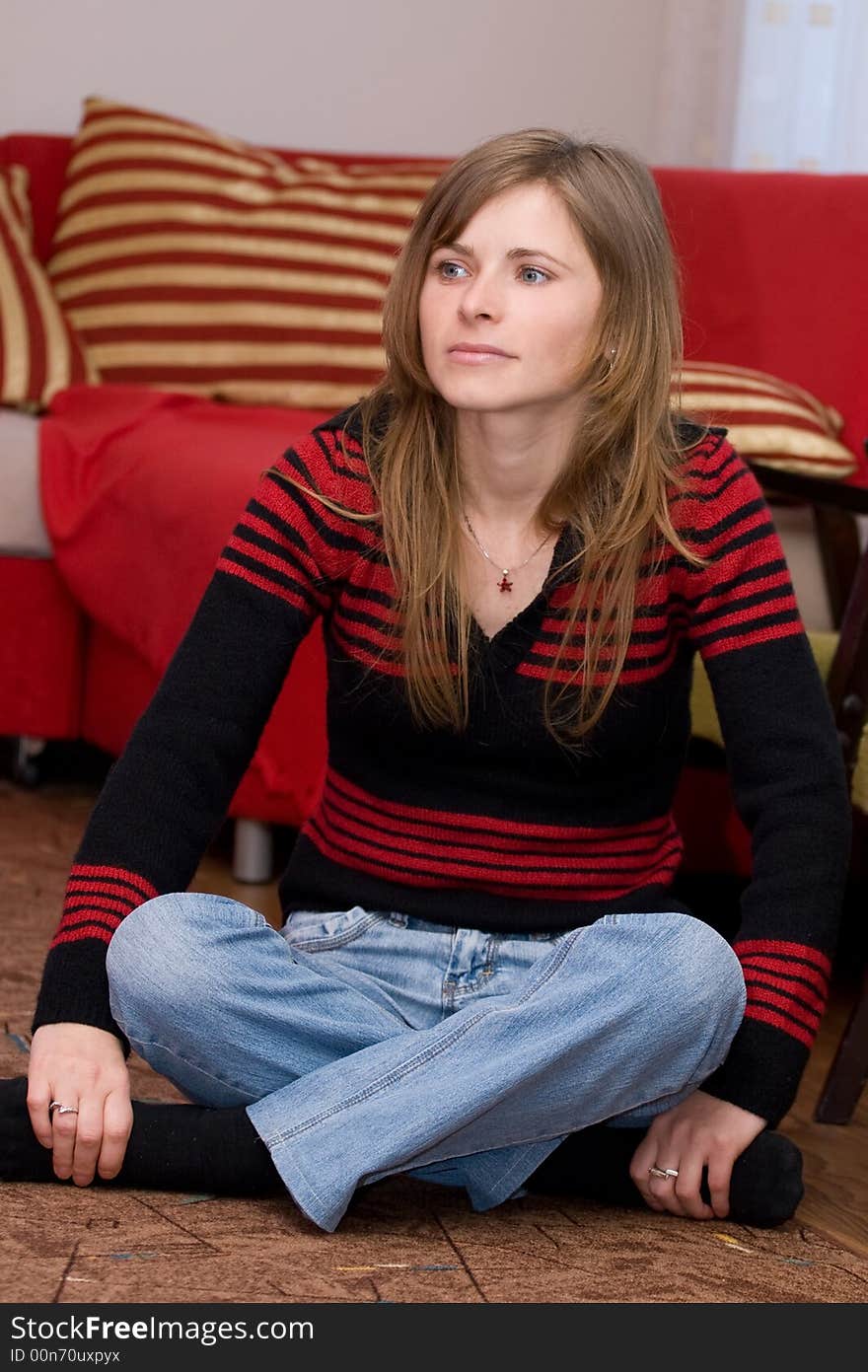 Beautiful girl thinking on the floor