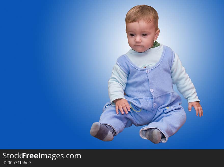 Cute young boy isolated on blue (with clipping path). Cute young boy isolated on blue (with clipping path)