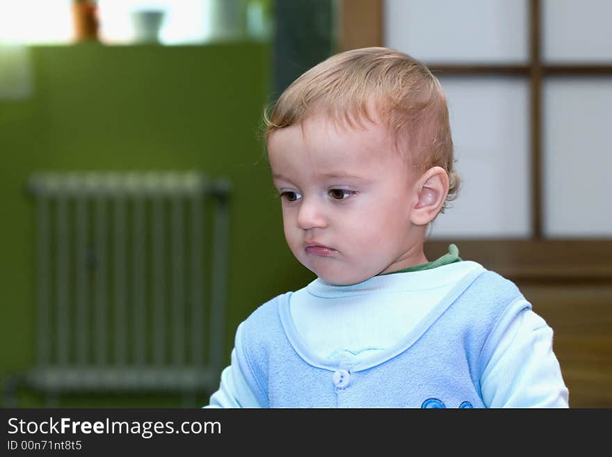 Blond child with cute face close-up portrait