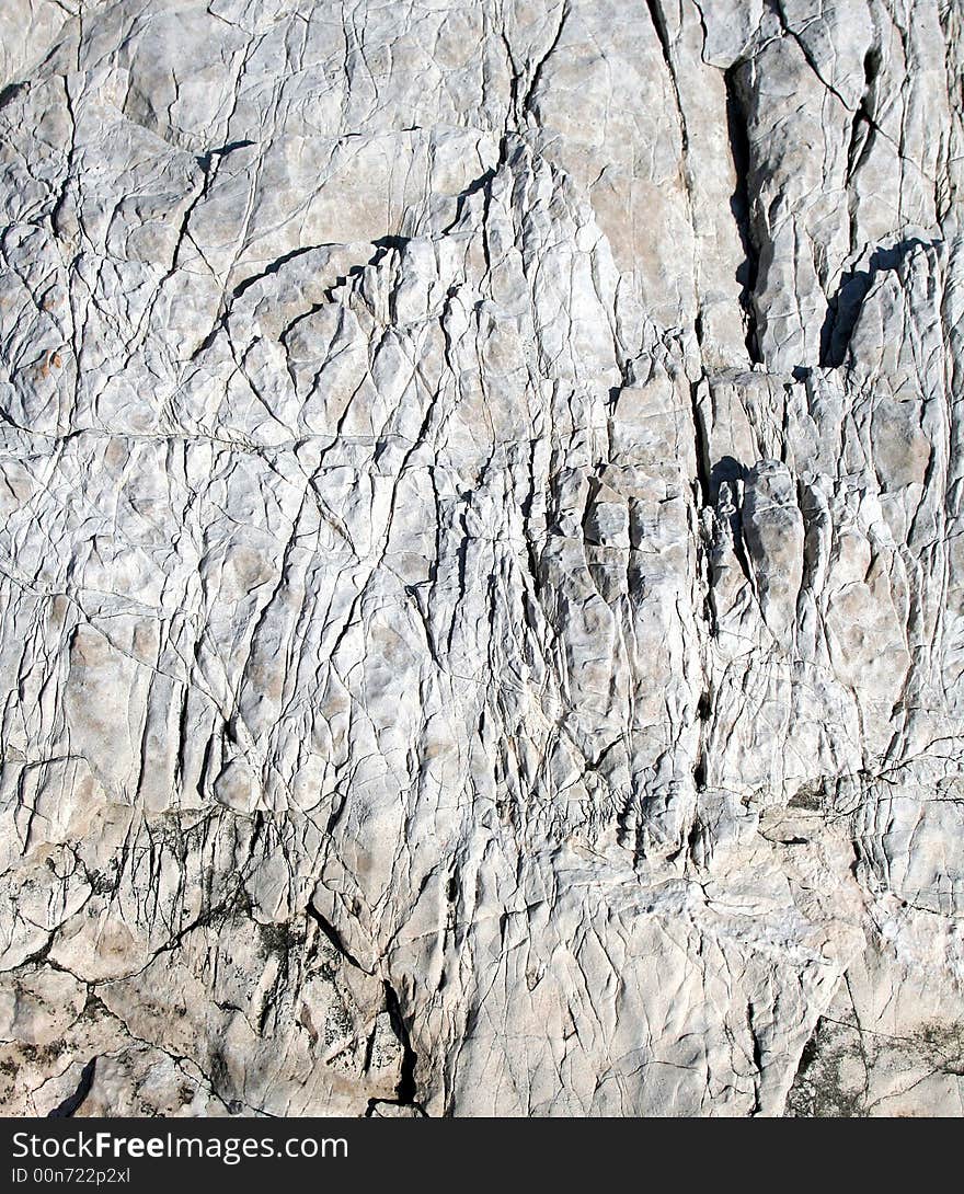 Rugged natural grey limestone surface. Rugged natural grey limestone surface