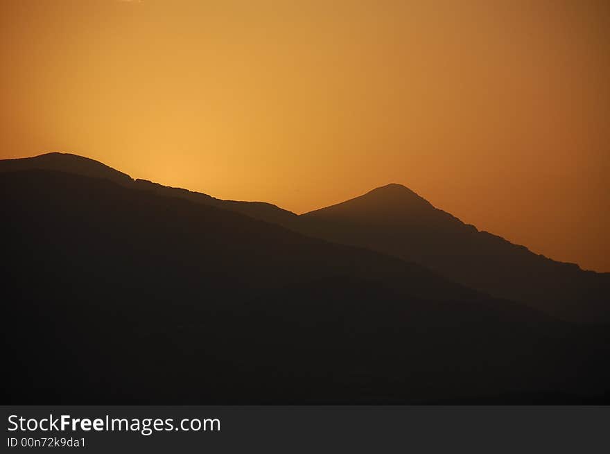 Sunrise behind mountain in Volos