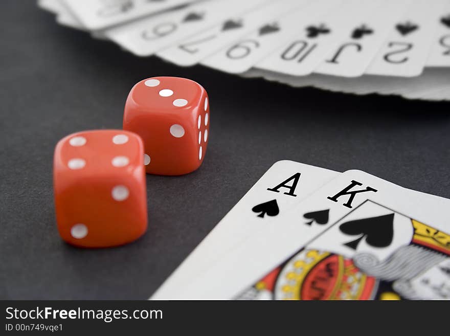 Playing Cards & Dice on Black Surface. Playing Cards & Dice on Black Surface