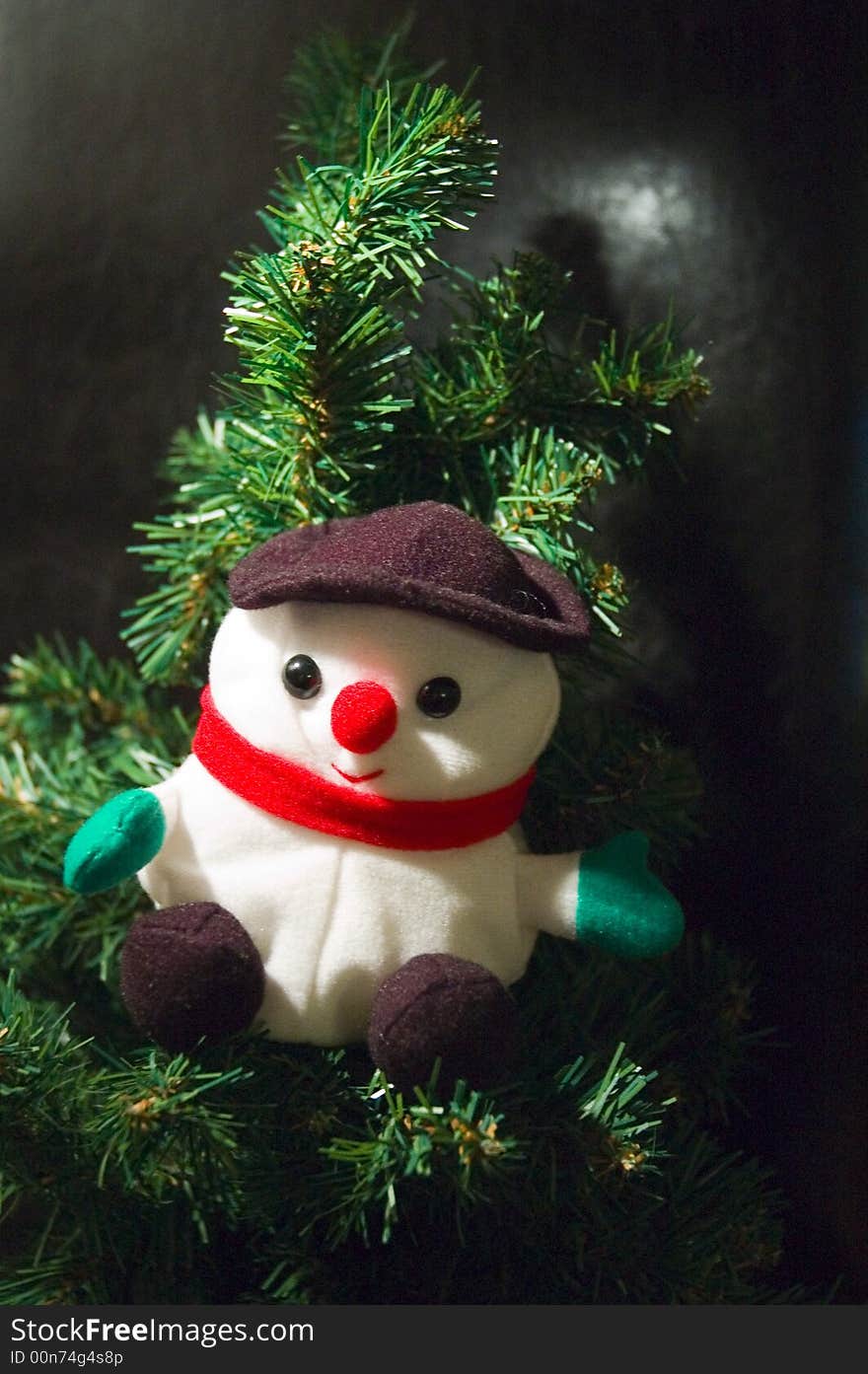 A santa claus puppet in a christmas tree