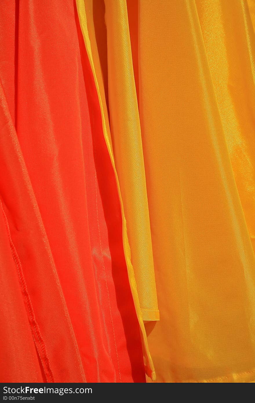 Close up of two different colored raincoats