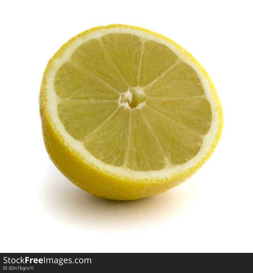 Lemon Half: Straight Product Shot taken in Studio in Natural Light isolated against White Background. Lemon Half: Straight Product Shot taken in Studio in Natural Light isolated against White Background