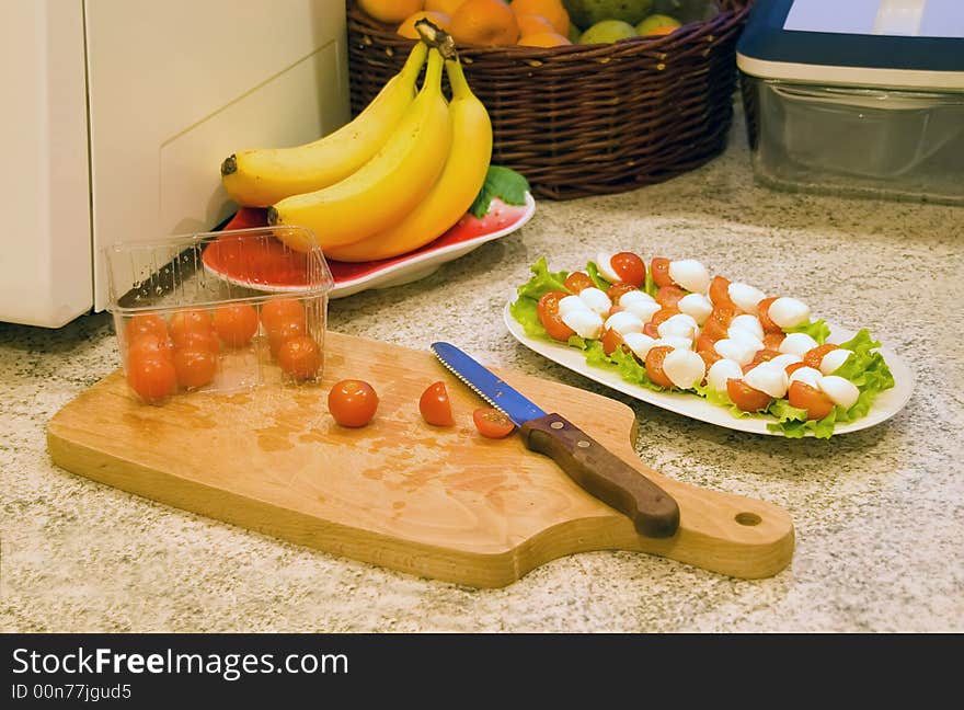 Small tomatoes with mozzarella cheese. Small tomatoes with mozzarella cheese