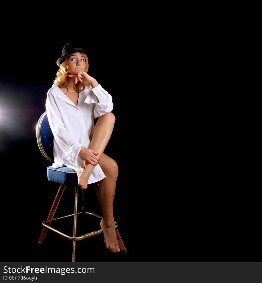 Beautiful young girl posing on dark background