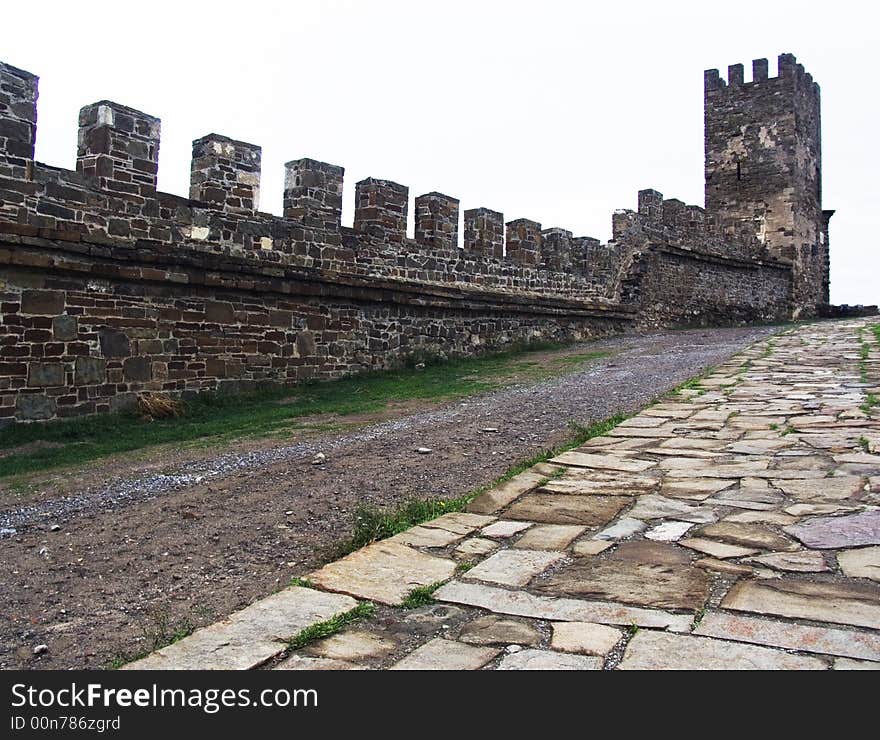 Tower, wall and road of an old Byzantian fortress in the Sudak in Crimea. Tower, wall and road of an old Byzantian fortress in the Sudak in Crimea.