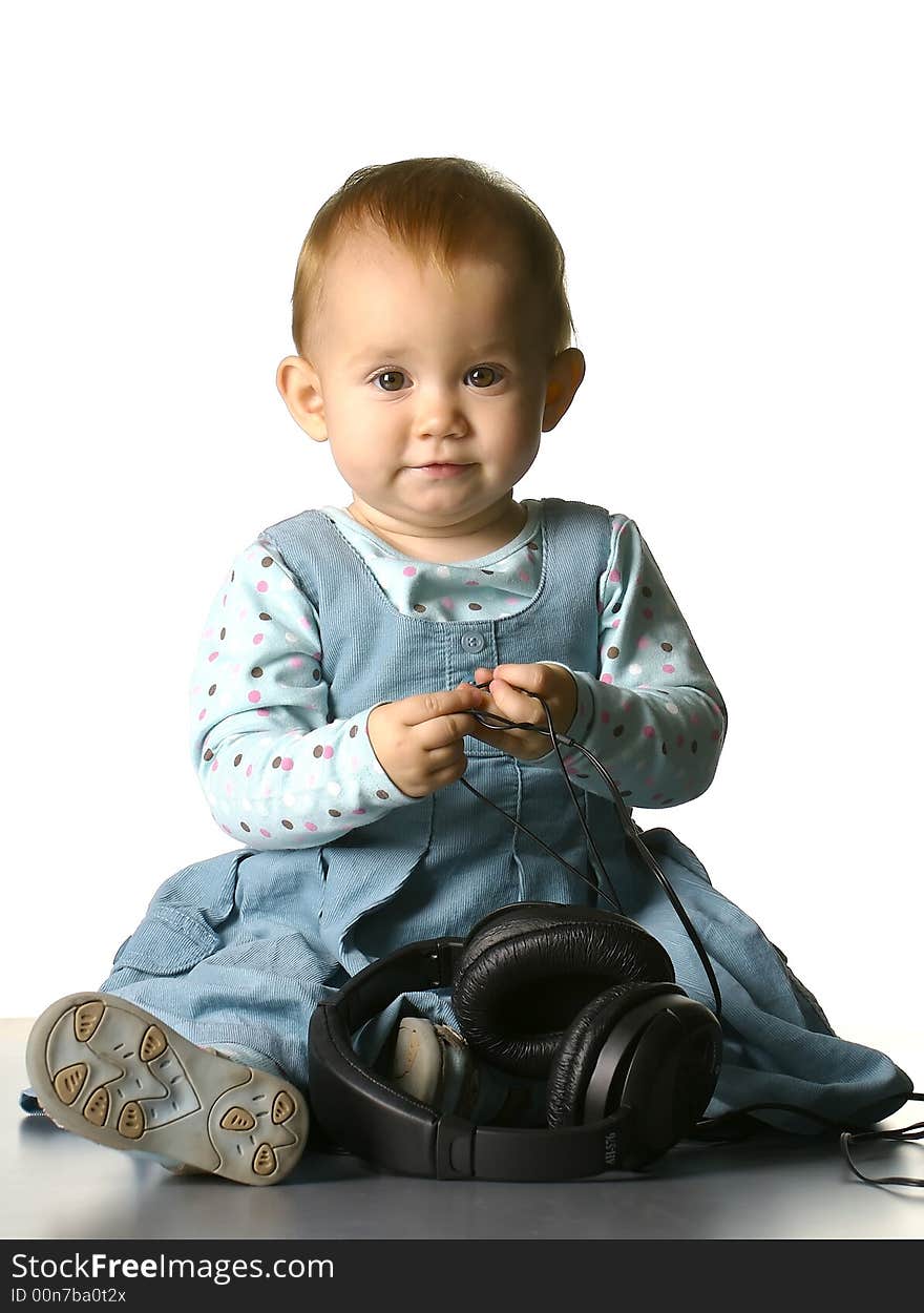 The girl with headphones on a white background