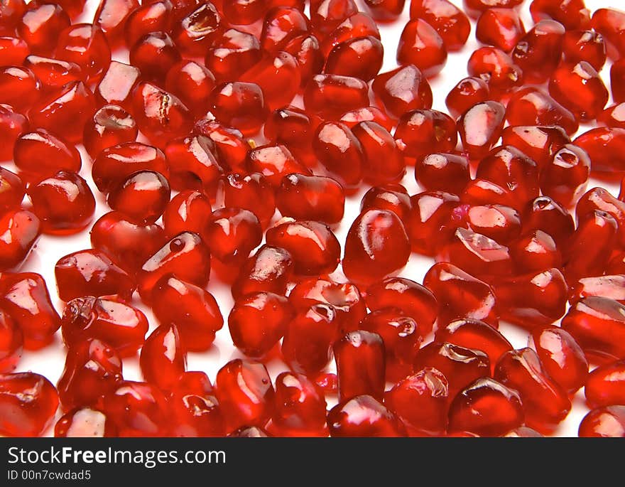 Ripe pomegranate on a white background