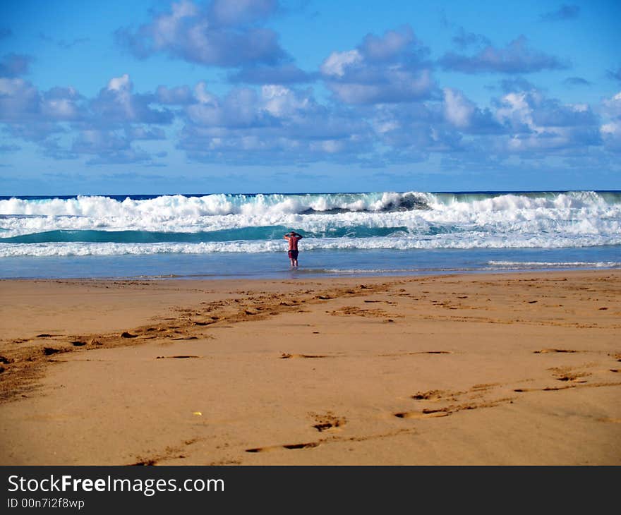 Guy looks waves on the seashore. Guy looks waves on the seashore