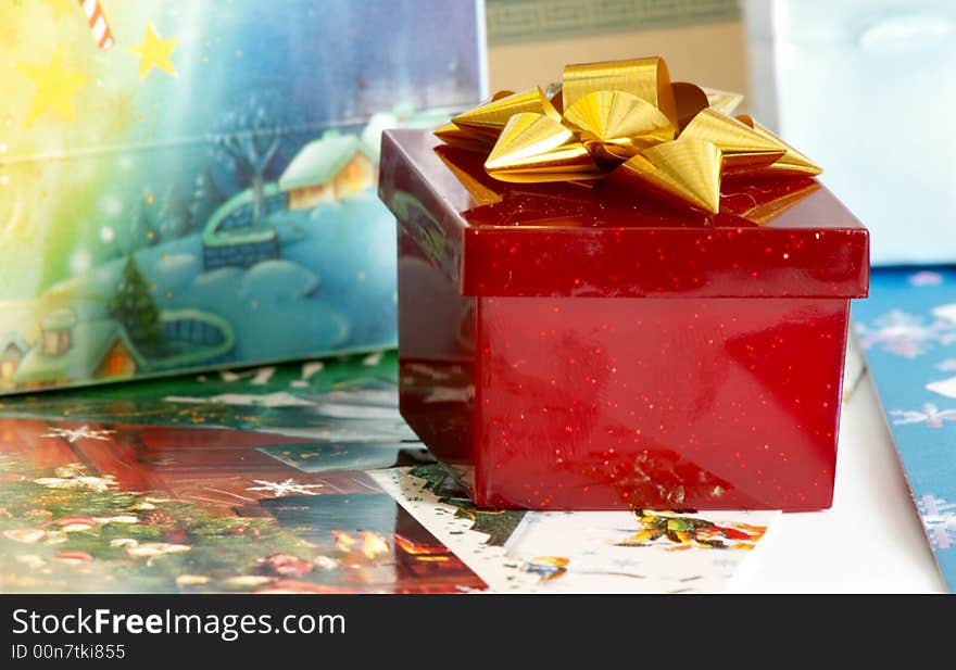 An image of red box with present. An image of red box with present