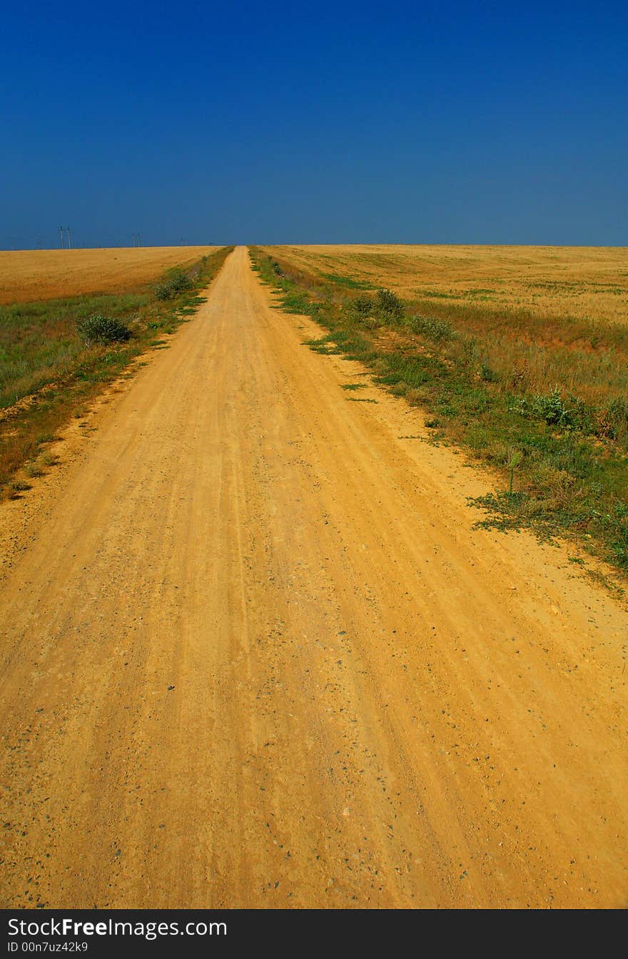 Road on a background of a field