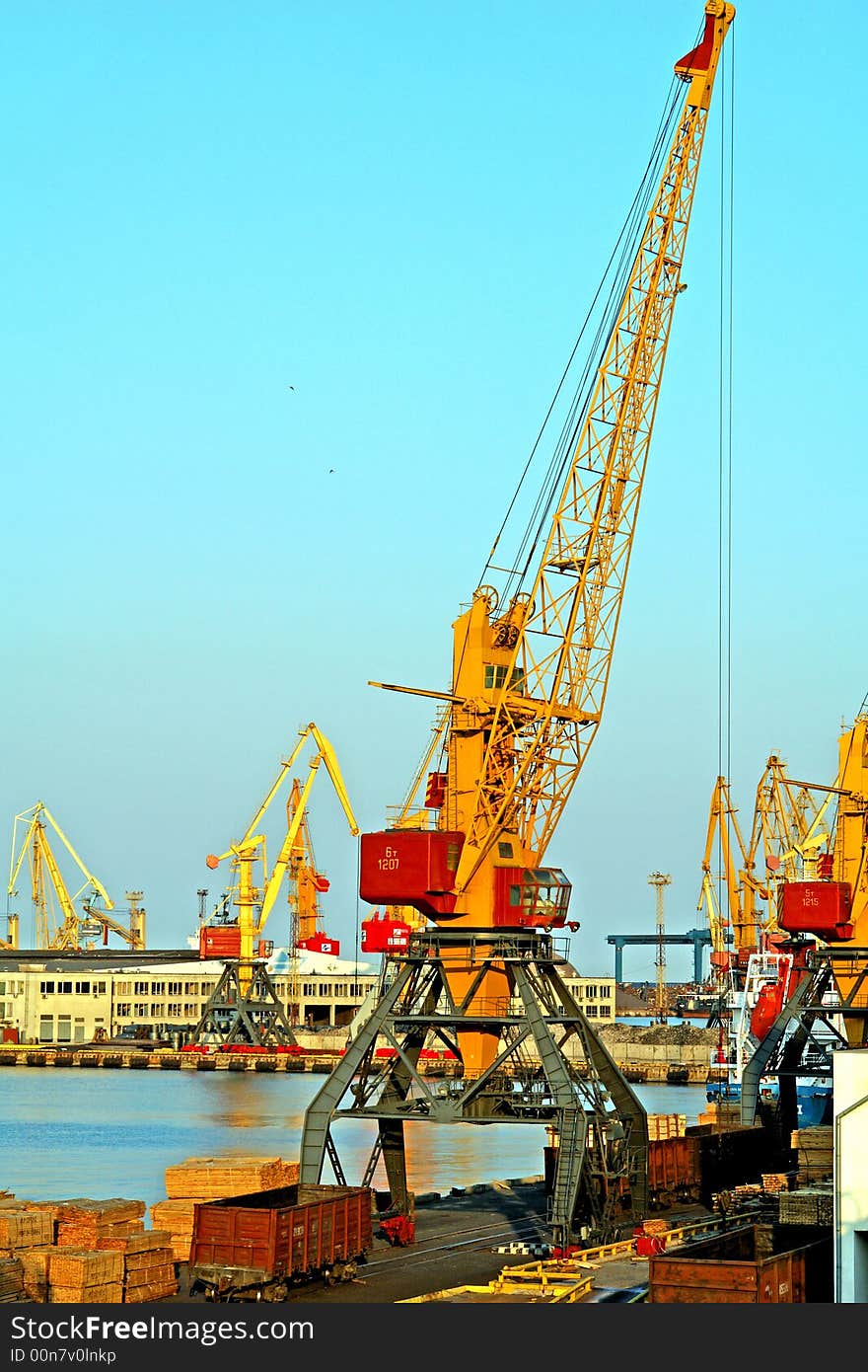 Loading cranes on a background of the sky