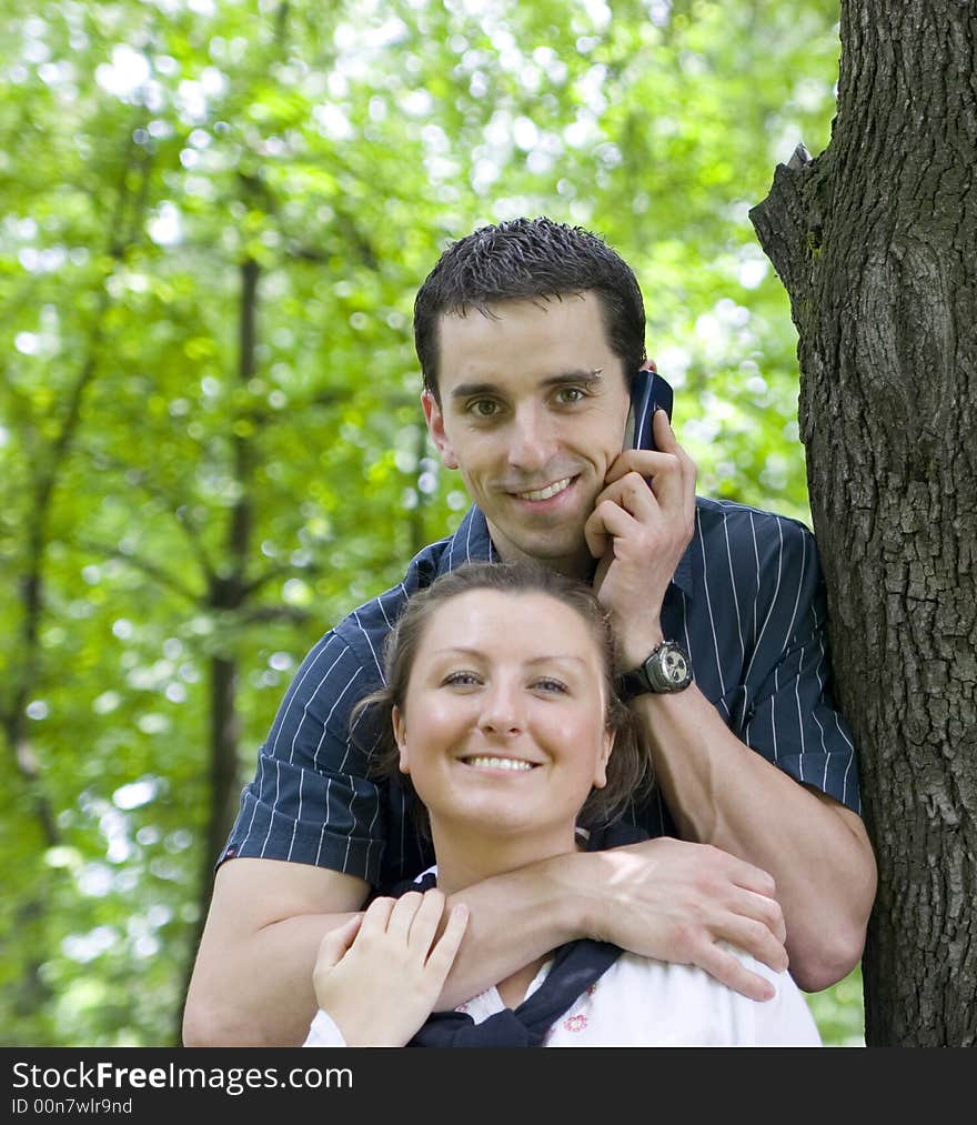 Happy couple in park falling in love