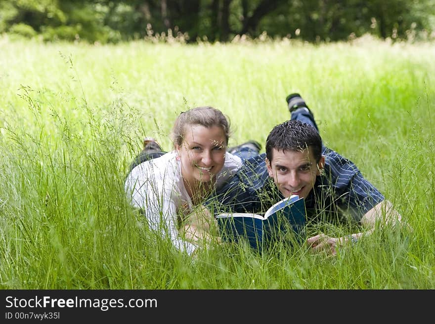 Happy couple with book