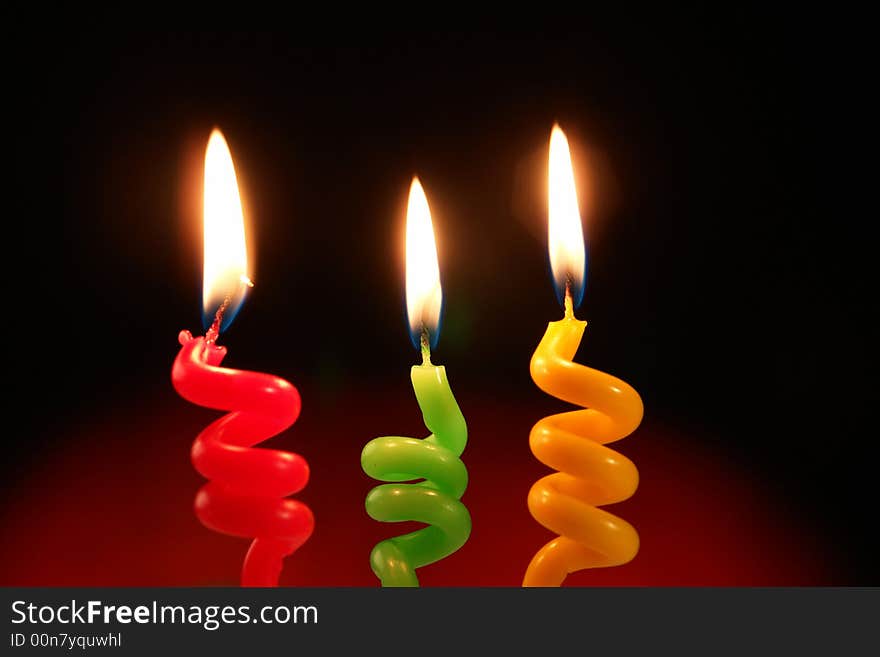 Candle on a black background