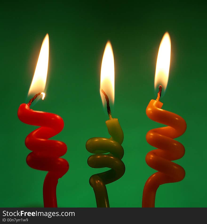 Candle on a green background