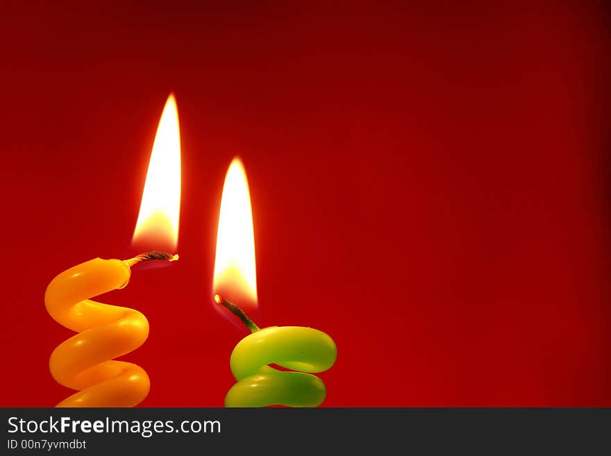 Candle on a red background