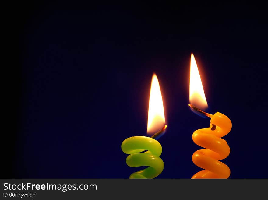 Candle on a black background