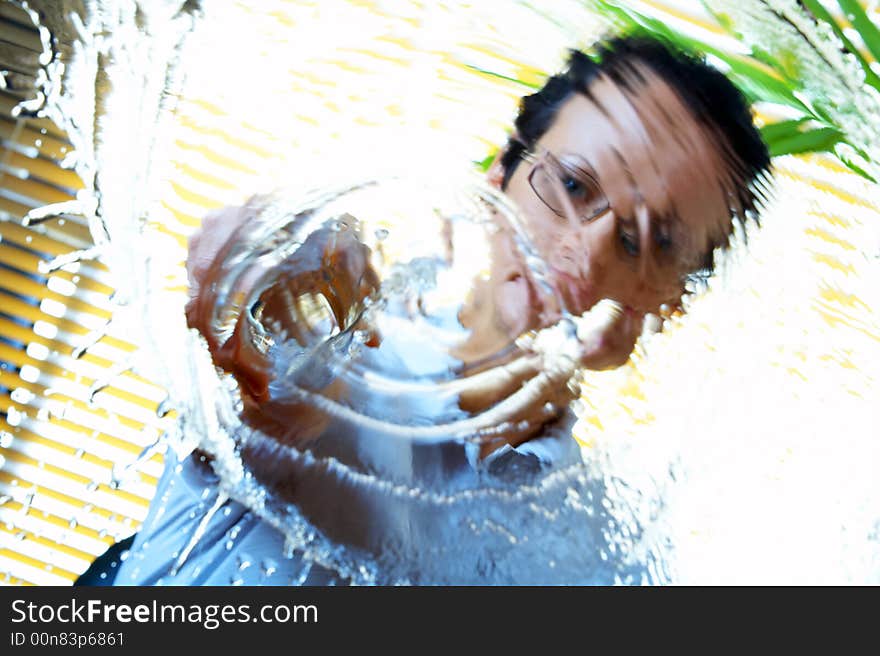 Portrait of  woman splashing water un to  the camera. Portrait of  woman splashing water un to  the camera