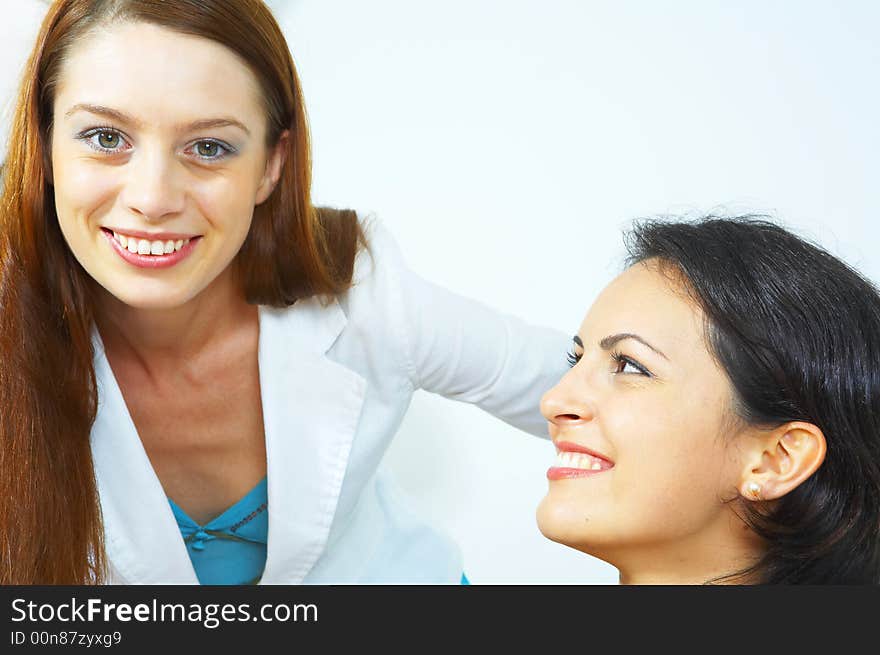 Portrait of two young woman on white back. Portrait of two young woman on white back