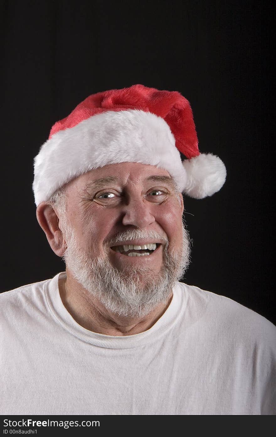 Jolly old man in a santa claus hat. Jolly old man in a santa claus hat