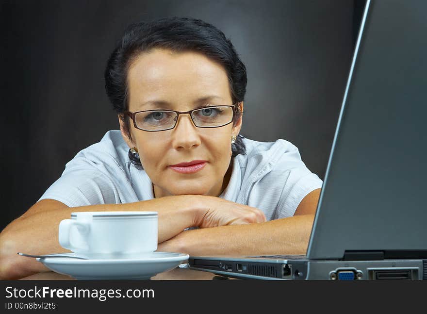 Portrait of  businesswoman in stylish glasses posing on black back. Portrait of  businesswoman in stylish glasses posing on black back