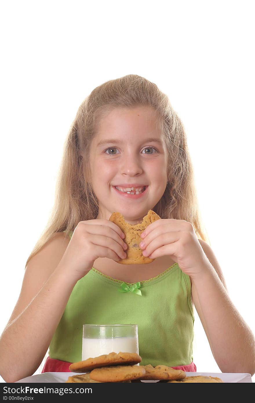 Young child eating chocolate chip cookie