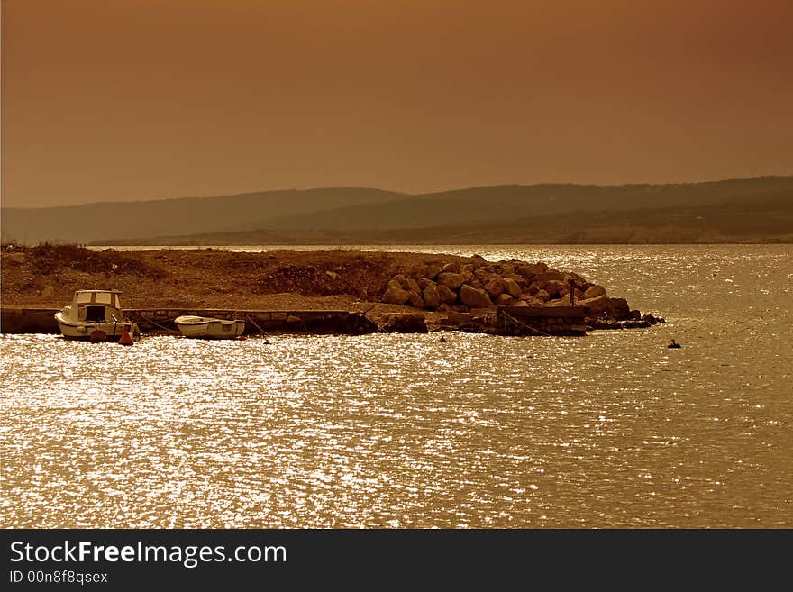 Seascape at sunset with boats