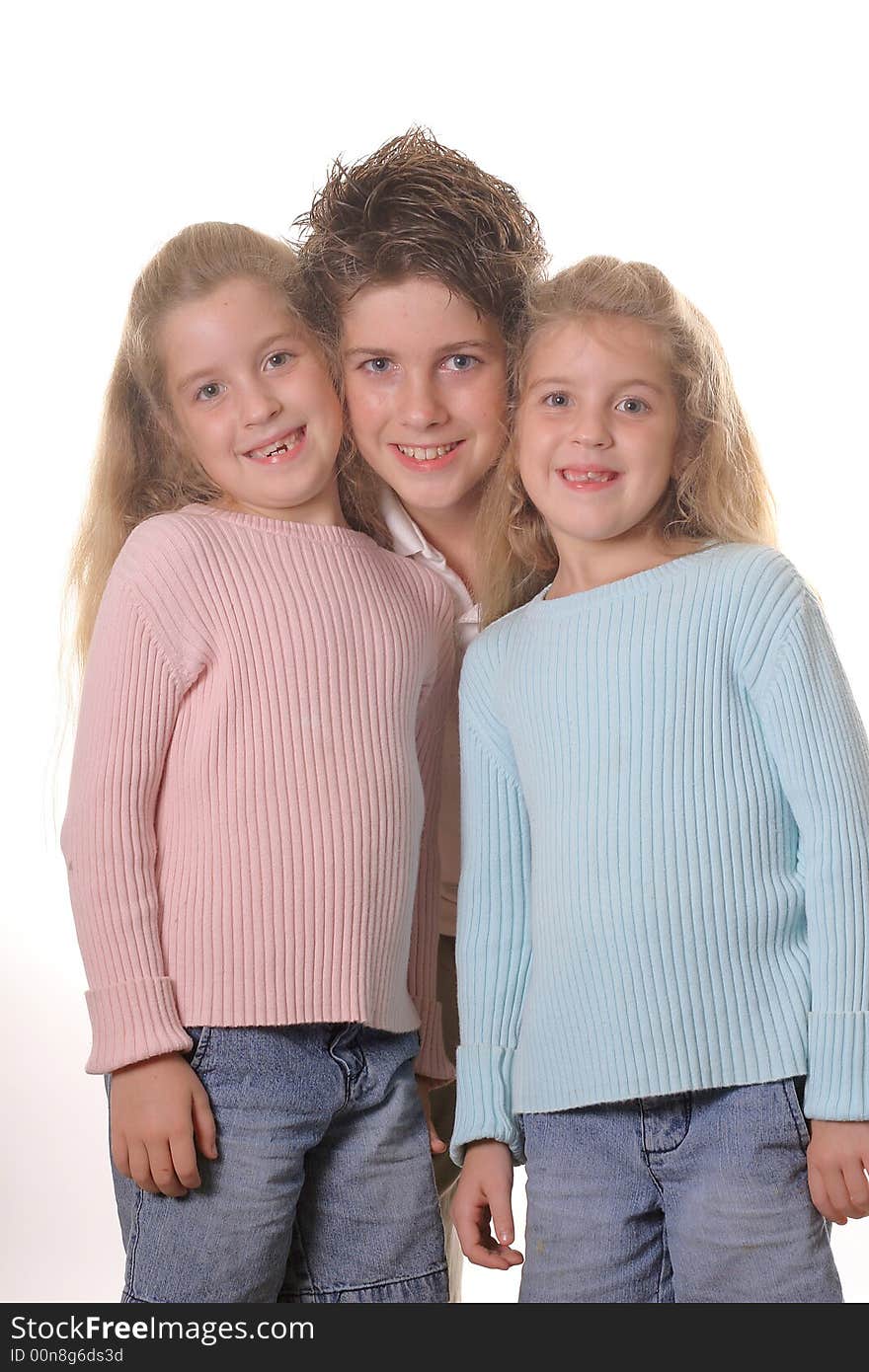 Three siblings on white vertical