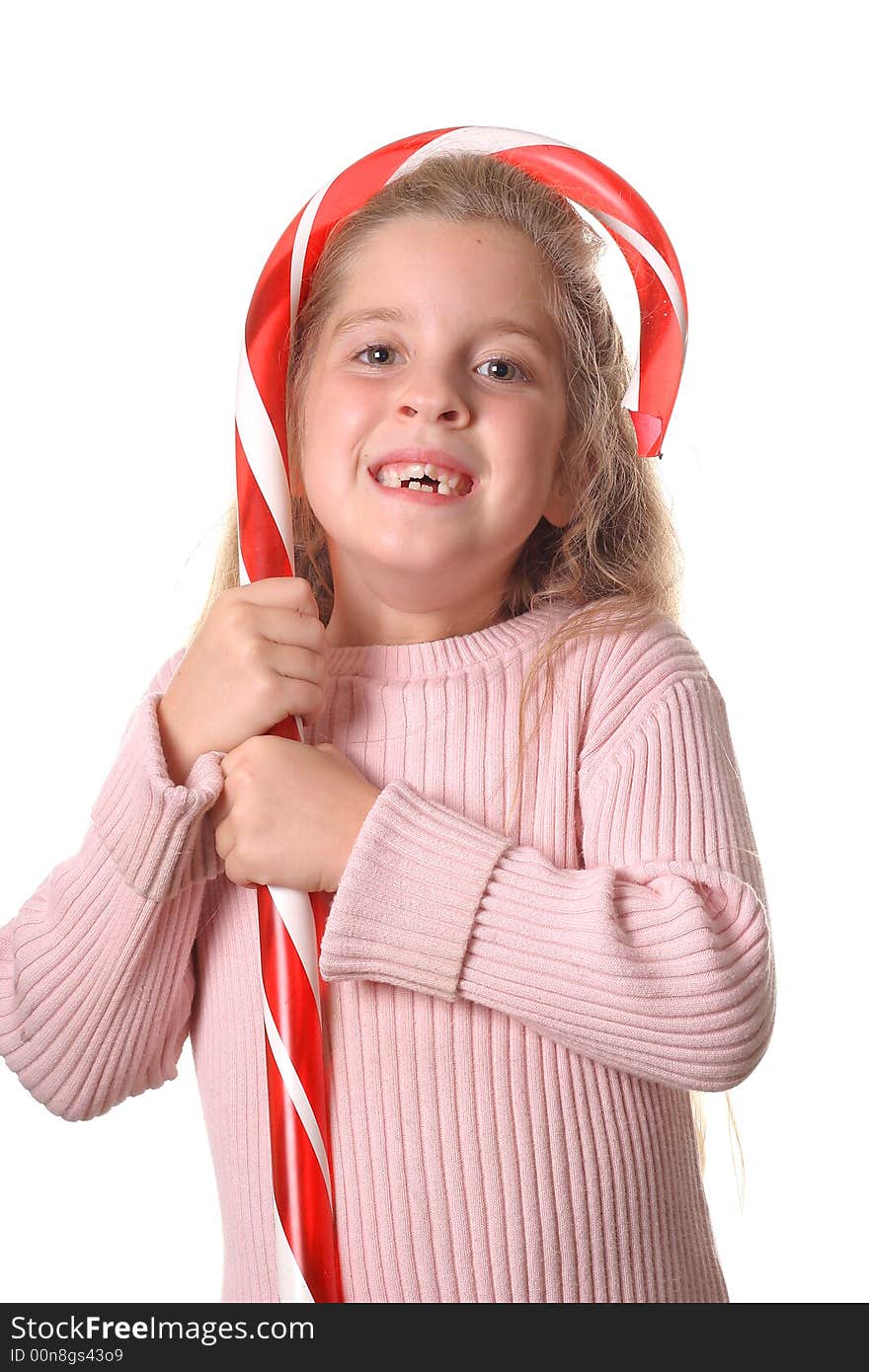 Shot of a little girl with candy cane vertical