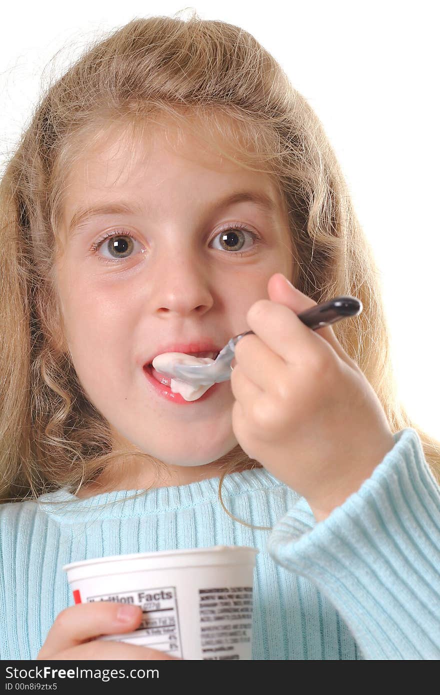 Young Girl Eating Yogurt Vertical