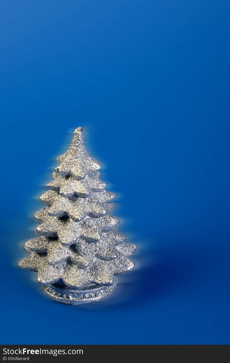 Beautiful single christmas tree on blue background. Beautiful single christmas tree on blue background