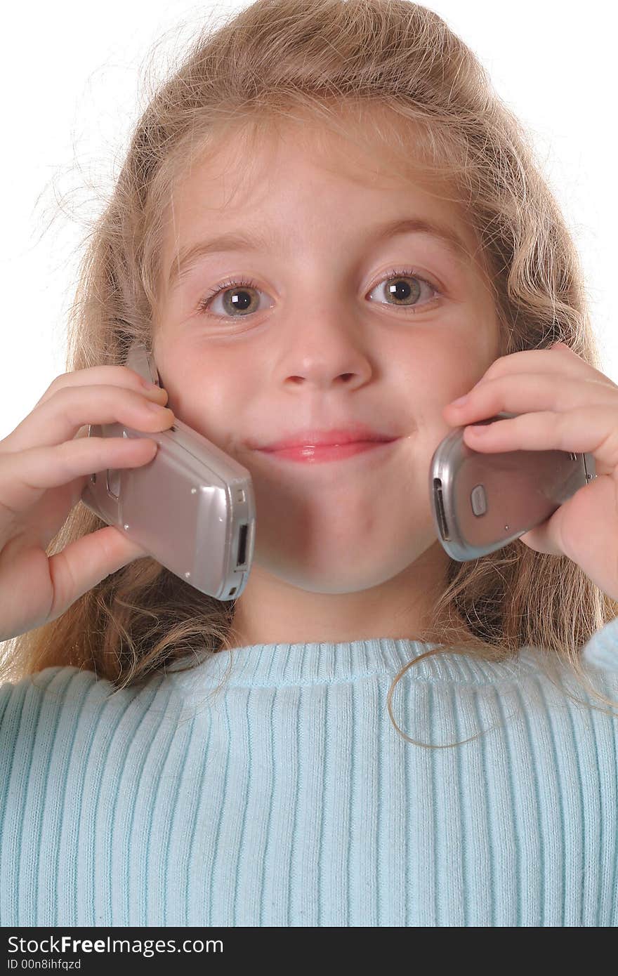 Shot of a young girl talking on two cellphones