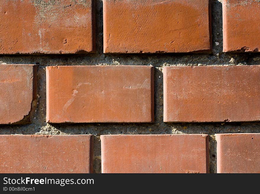 Reddish-brownish colored brick wall texture